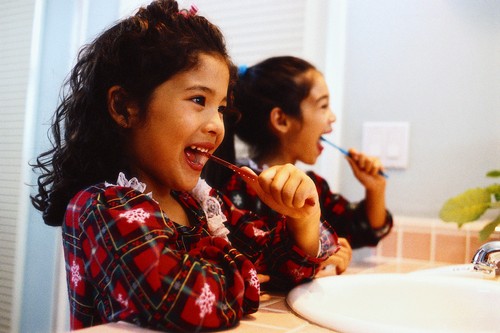 little girls brushing teeth